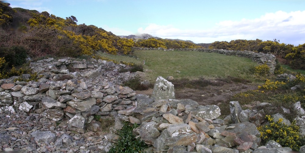 At the base of Holyhead Mountain, is this impressive, substantial group of hut circles.  In the 1860s in excess of 50 buildings were recorded, but now numbers around 20.

Active settlement was on this location for sometime, and not all the remains seen are contemporary with each other.

Finds at this location, and very nearby, date occupation from mesolithic to Romano British times.

The hut