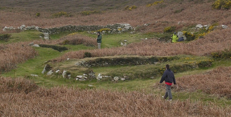 At the base of Holyhead Mountain, is this impressive, substantial group of hut circles.  In the 1860s in excess of 50 buildings were recorded, but now numbers around 20.

Active settlement was on this location for sometime, and not all the remains seen are contemporary with each other.

Finds at this location, and very nearby, date occupation from mesolithic to Romano British times.

The hut