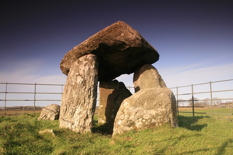 A beautiful Dolmen, trapped behind bars, maybe they're scared it'll run away.