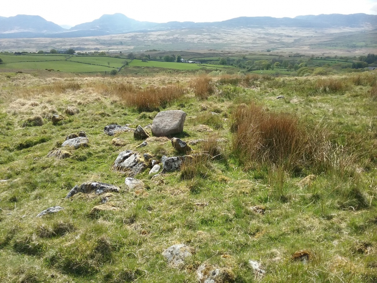 View to the south west across the cairn with Rhinog Fach and Rhinog Fawr top left.