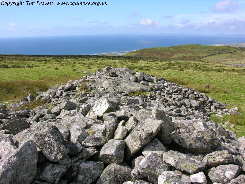 Looking west into Cardigan Bay along the central length of the southern tomb - a ruined portal dolmen at the east end, with a likely Cotswold-Severn incorporated into the more western end.