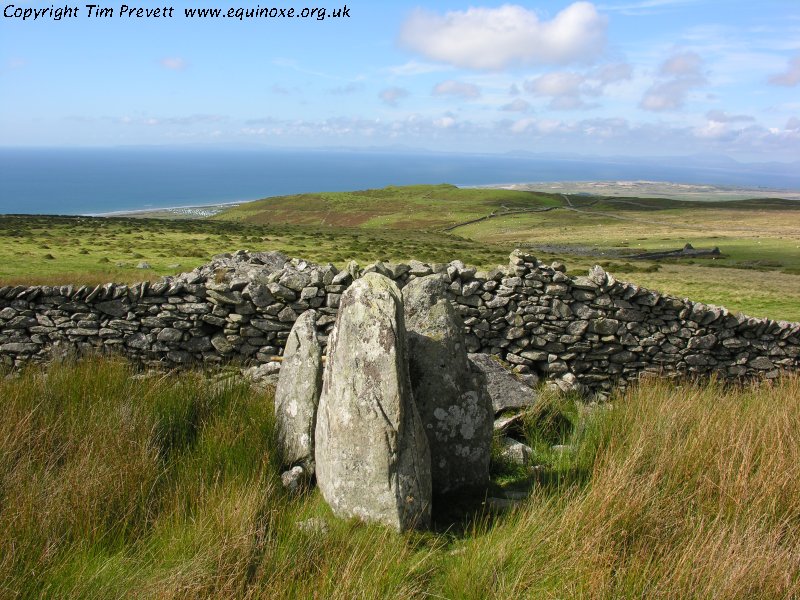 Looking west into Cardigan Bay along the length of the southern tomb - a ruined portal dolmen at the east end, with a likely Cotswold-Severn incorporated into the more western end.