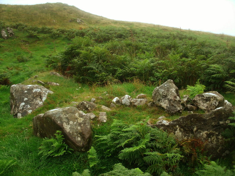 The Southern [kerb]cairn measuring 6m in diameter with a kerb of massive stone slabs - SH63321263.