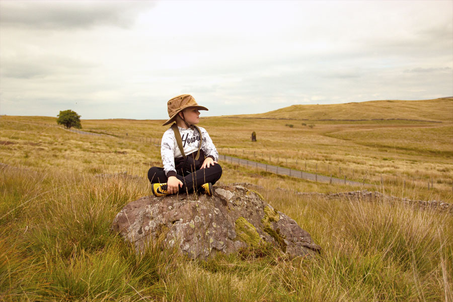 This stone, sited on a line between the henge and Maen Llia, is part of the Llia valley triangle layout. It is known as Rylee Jacks Rock.
   In the background can be seen Maen Llia standing stone, and the chap sat on the rock is none other than Rylee Jacks himself.