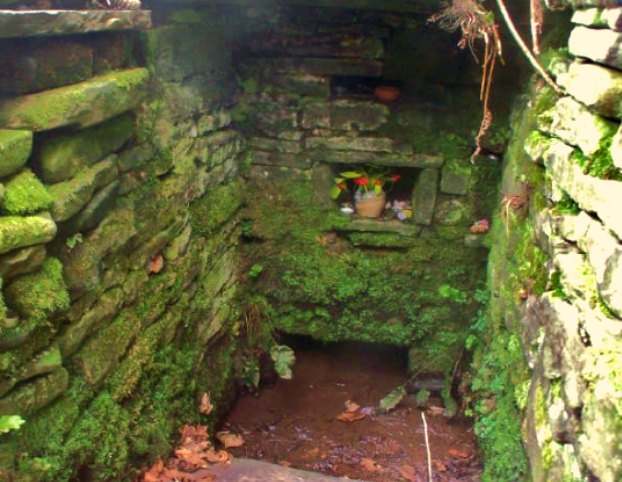 A close-up view of Ffynnon Ishow at Patrishow. The well basin is built over with a square stonework structure that has  niches for the placing of flowers and offerings. The water always looks fairly clear. Twigs in the shape of crosses are left around the well. St Issui dwelt here in the 6th or 7th century and was martyred by a person for whom he gave sanctuary to.