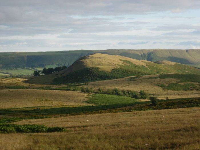 A situation worthy of Lord of the Rings - Castle Bank in Radnorshire. Its situation is best appreciated from the hills surrounding its location in the vast natural amphitheatre. The univallate earthwork and stone ring are easily traced from this distance. A fine 3D fly-through model can be seen of this  at Llandrindod Wells museum.