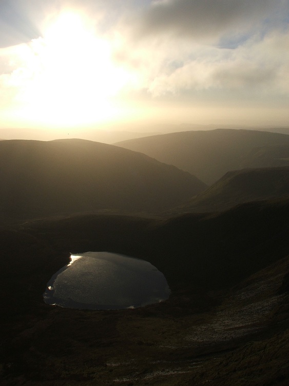 Dawn hits the Berwyns, as seen from Cadair Berwyn cairn 2, Llyn Lluncaws.